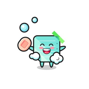 Mavi yapışkan nota karakteri sabun tutarken banyo yapıyor, tişört, etiket, logo elementi için şirin bir tasarım.