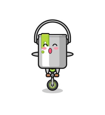 Şirin boya kutusu karakteri sirk bisikleti sürüyor. Tişört, çıkartma ve logo için şirin bir tasarım.