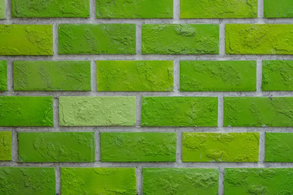 Dokulu arka plan boş yeşil tuğla duvar.