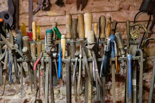 Vintage Tools In A Tool Shed Or Workshop screwdriver, chisel, tweezers, pliers, scissors pliers, hammer,