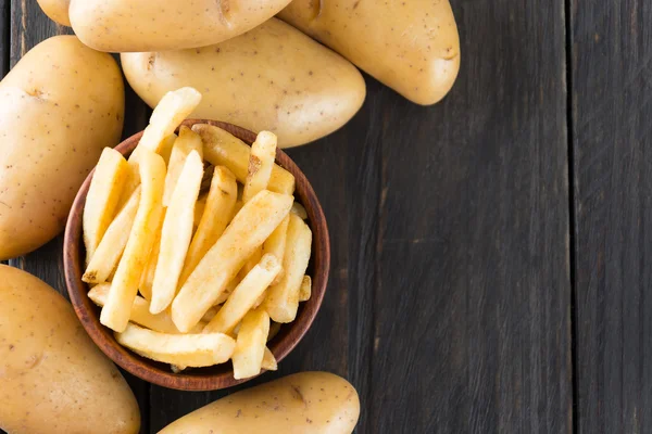 French fries on wood background — Stock Photo, Image