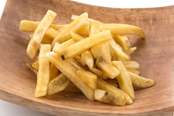 Τηγανητές πατάτες σε ξύλινο πιάτο — Φωτογραφία Αρχείου