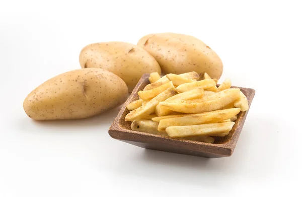 Batatas fritas em placa de madeira — Fotografia de Stock