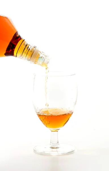 Pouring wisky on white background — Stock Photo, Image