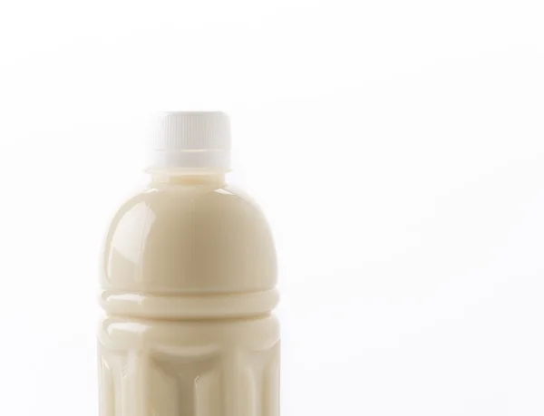 Leche de soja en botella sobre blanco — Foto de Stock