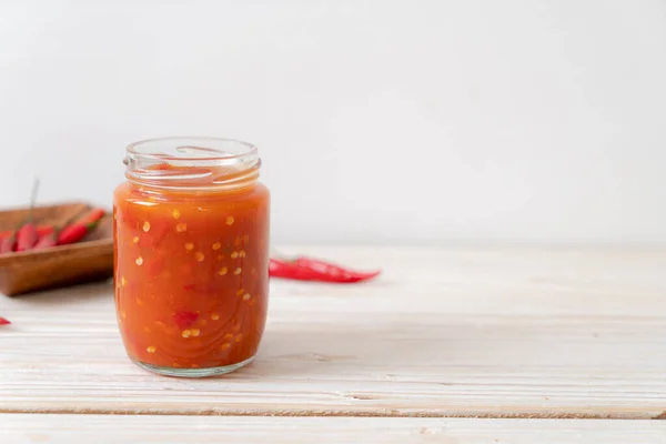 Chilli Chilli Sauce Bottle Jar Wwod Background — Stock Photo, Image