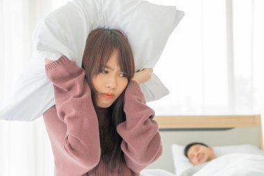 The Asian wife have problems with snoring husband