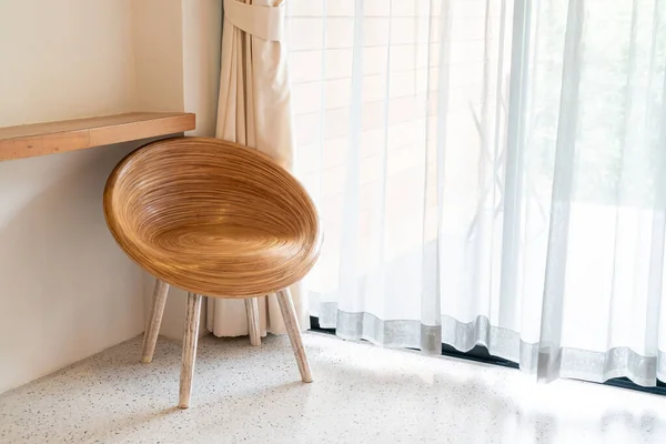 empty wood chair on corner in a room