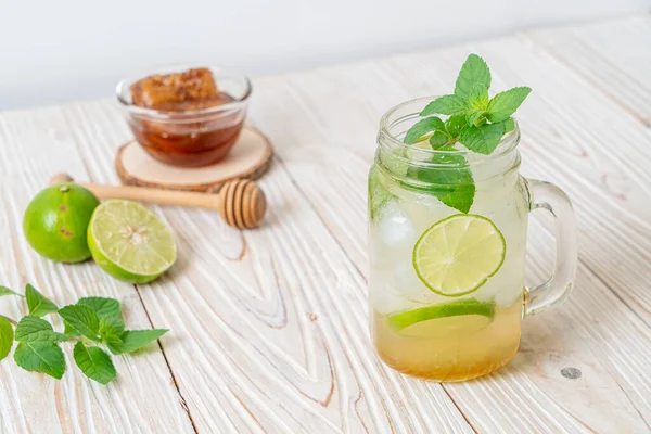 iced honey and lime soda with mint - refreshing drink