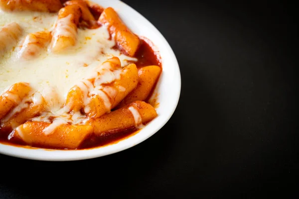 Korean rice cake in spicy Korean sauce with cheese, Cheese Tokpokki, Tteokbokki with Cheese - Korean food style