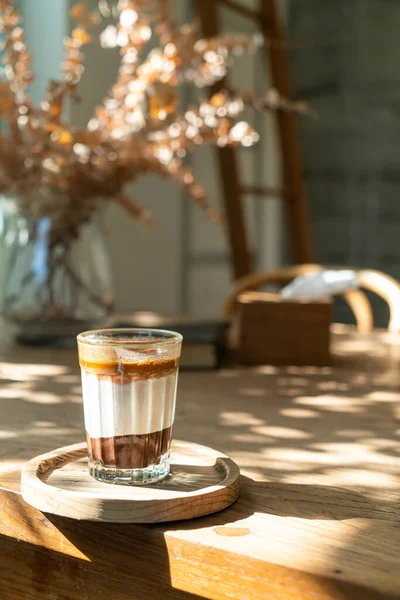 double dirty coffee cup (espresso coffee with milk and chocolate) in coffee shop cafe