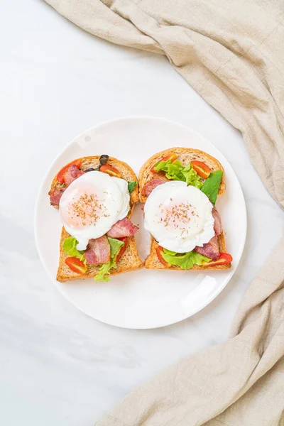 whole wheat bread toasted with vegetable, bacon and egg or egg benedict for breakfast