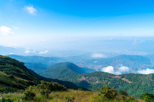 beautiful mountain layer with clouds and blue sky at  Kew Mae Pan Nature Trail in Chiang Mai, Thailand