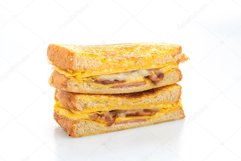 French toast ham bacon cheese sandwich with egg isolated on white background