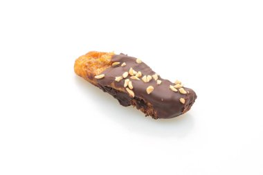 Güneş ışığı, muzlu çikolatayı kurutur ya da muz soslu çikolatayı beyaz arka planda izole eder.