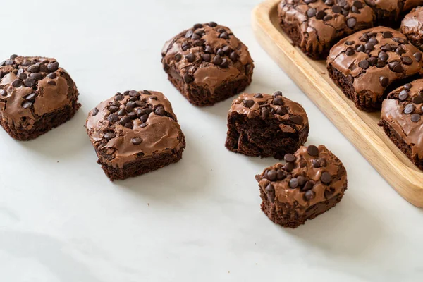 dark chocolate brownies with chocolate chips on top