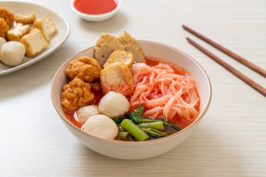 small flat rice noodles with fish balls and shrimp balls in pink soup, Yen Ta Four or Yen Ta Fo - Asian food style clipart