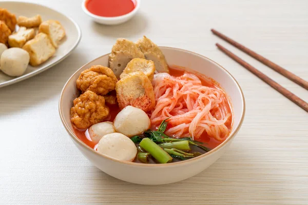 small flat rice noodles with fish balls and shrimp balls in pink soup, Yen Ta Four or Yen Ta Fo - Asian food style