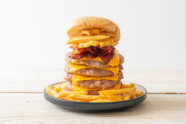 pork hamburger or pork burger with cheese, bacon and french fries