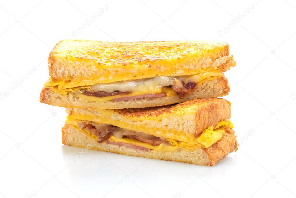 French toast ham bacon cheese sandwich with egg isolated on white background