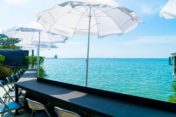 empty outdoor bar and chair with sea background