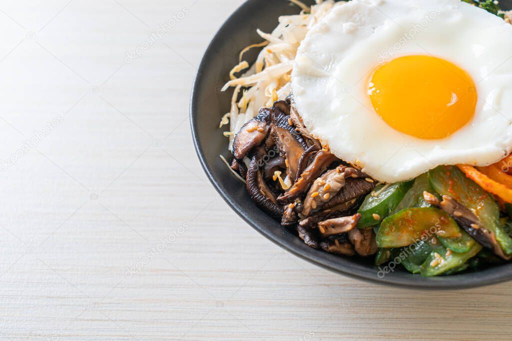 Bibimbap, Korean spicy salad with rice and fried egg - traditionally Korean food style