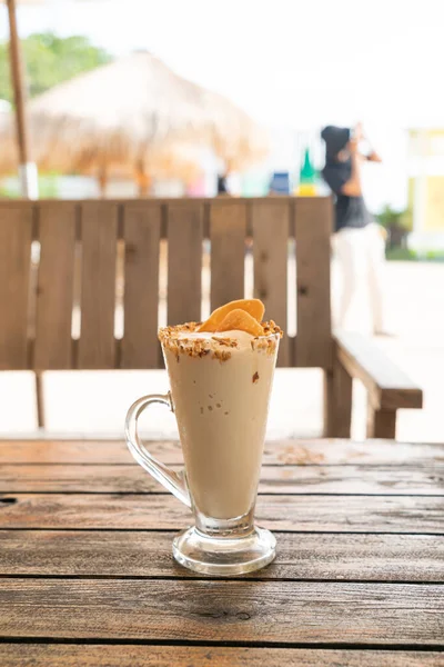 caramel coffee nut smoothie milkshake glass in cafe and restaurant
