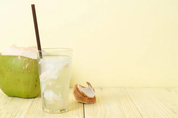 coconut water or coconut juice in glas with ice cube