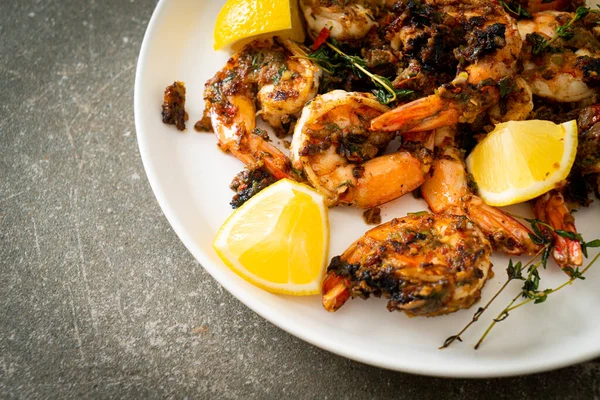jerk shrimps or grilled shrimps in Jamaica style on plate