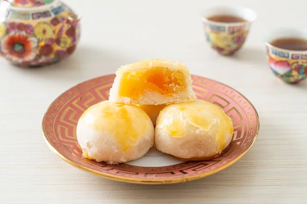 Chinese pastry moon cake with salted egg peanut or Spring Roll pastry with nuts and salted eggs - Asian food style