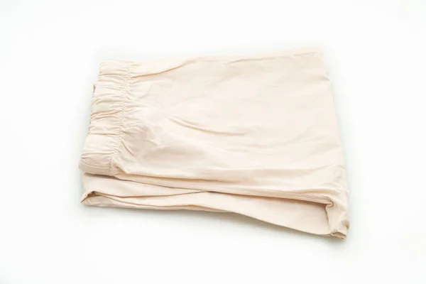 在白色背景上孤立的米色裤子褶皱 — 图库照片