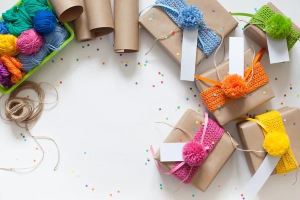 Preparation for the holiday. Gifts wrapped in kraft paper. Confe