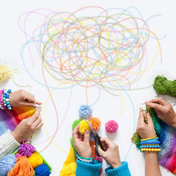 The women knit and crochet colored fabric. View from above. — Stock Photo, Image