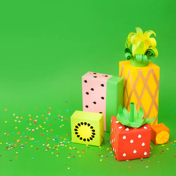 stock image Gifts wrapped in colored paper. Gifts like fruit. Fruit boxes.