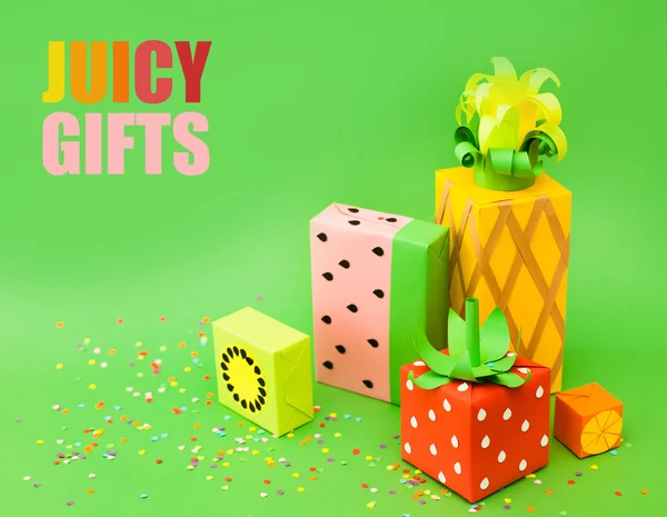 Gifts wrapped in colored paper. Gifts like fruit. Fruit boxes.