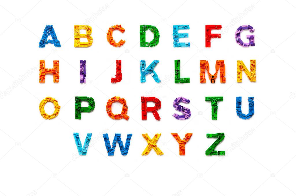 Khabarovsk, Russia, November 17, 2020. Flat lay colourful abc alphabet letters made from the construction blocks of the Lego constructor on white isolated background. Letter mosaic with lego bricks. Alphabet font typeface. School education.