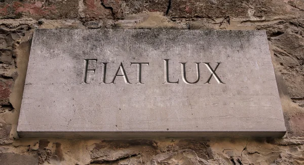 Fiat Lux. A Latin phrase meaning Let there be light. University of California motto.