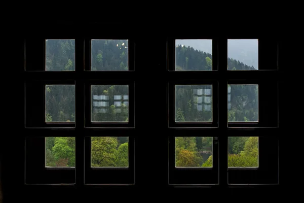 View of Austrian Woods in Tirol through Silhouetted Small Square Windows — Stock Photo, Image