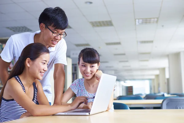 Young college students study together in the library — Stock Photo, Image