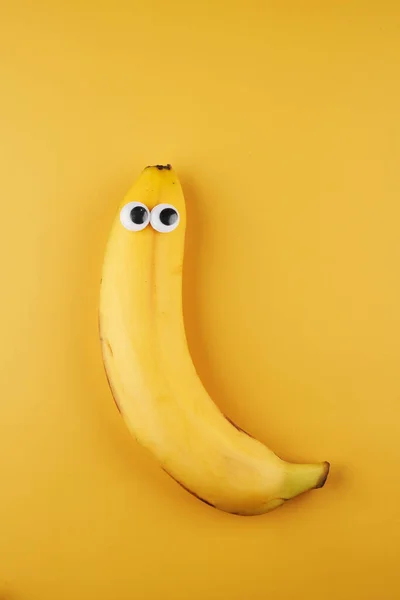 Funny Banana Eyes Concept Isolated Yellow Background Copy Space — Stock Photo, Image