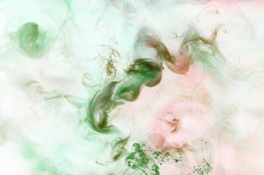 Renkli soyut arka plan, suda parlak karışım boyalar, canlı dans renkleri, suyun altında dönen duman. Aroma şehvetli konsept, narin parfüm