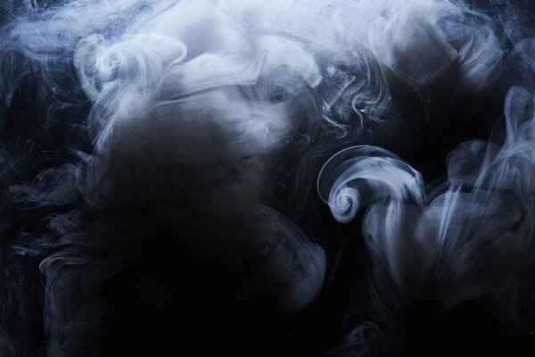 Abstract dark paint in water background. White smoke cloud motion on black, acrylic ink swirl splashes