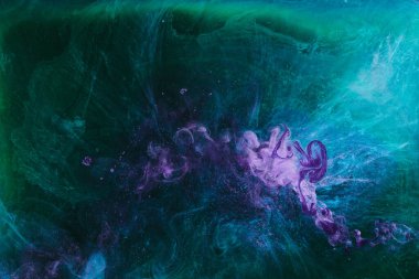 Abstract colorful smoke background. Moving flow of dark purple green paints, fluid art
