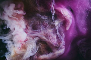 Abstract fluid art background. Moving flow of purple gold paints, dark space sky