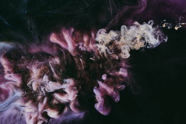 Abstract fluid art background. Moving flow of purple gold paints, dark space sky