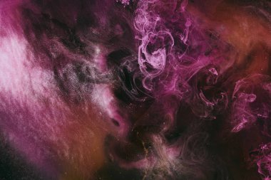 Abstract fluid art background. Moving flow of purple gold paints, dark space sky