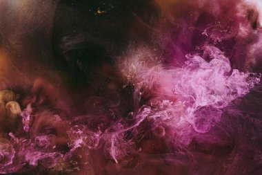 Abstract fluid art background. Moving flow of purple gold paints, dark space sky