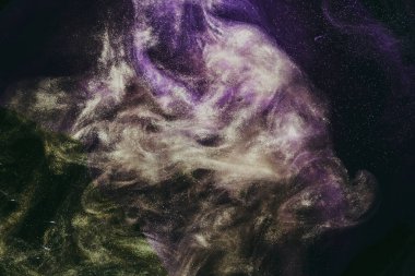 Abstract fluid art background. Moving flow of purple gold paints, dark space sky