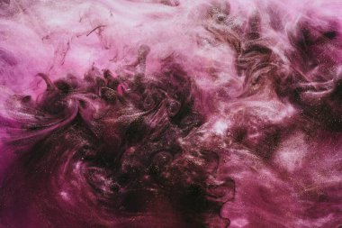 Abstract colorful smoke, dark background. Moving flow of pink paints, fluid art