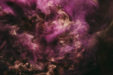 Abstract colorful smoke, dark background. Moving flow of pink paints, fluid art